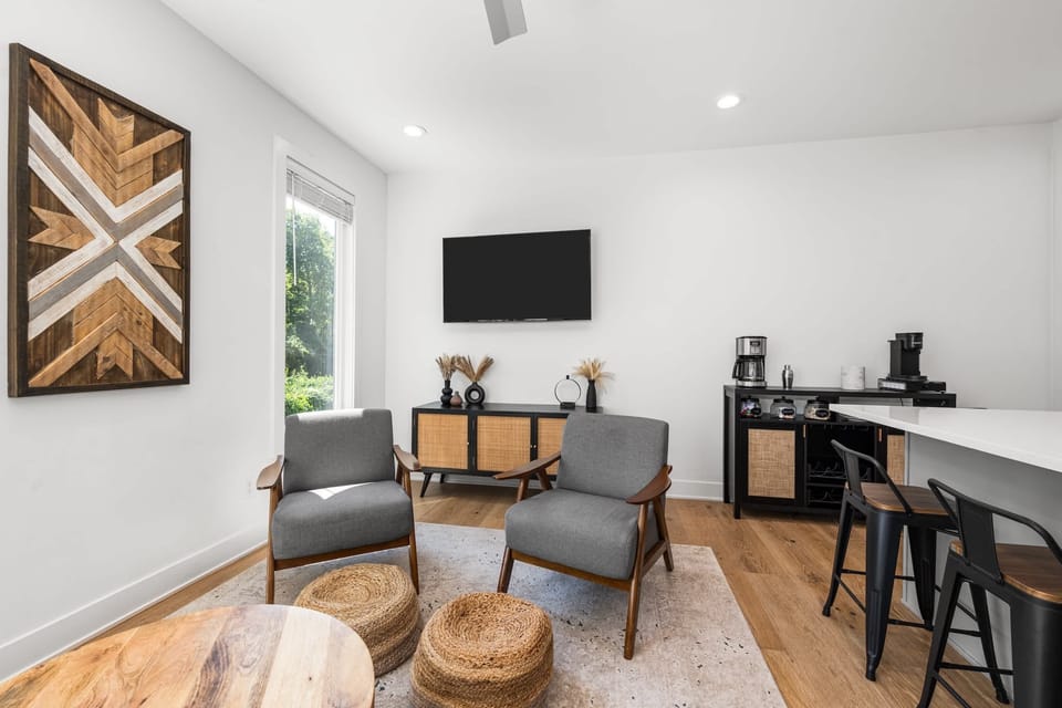 Bright, open living space with smart TV and queen sleeper sofa