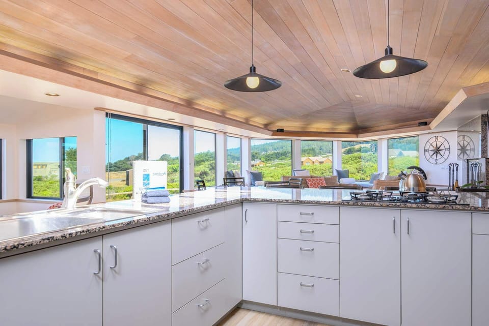 Cook with ease in the open kitchen, featuring modern appliances and ample space.