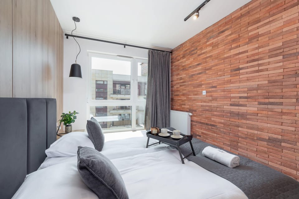 The bedroom's tasteful decor combines functionality with elegance. 