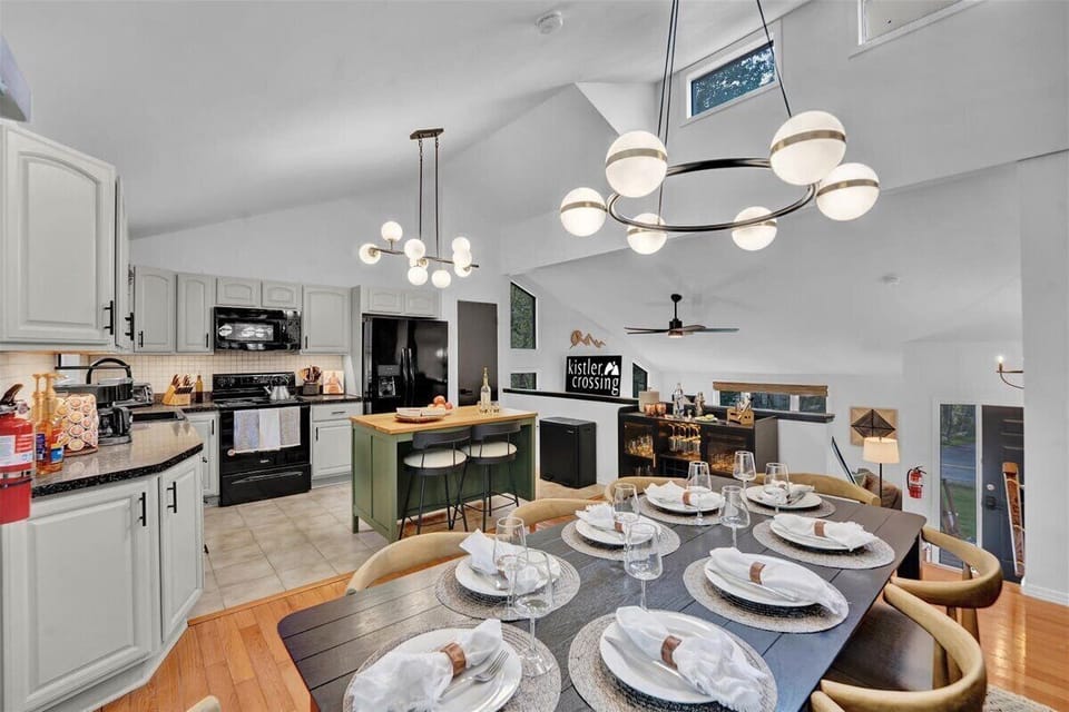 Our modern kitchen has everything for your culinary adventures. With ample counter space, a large island, and new appliances, all your cooking needs are covered.