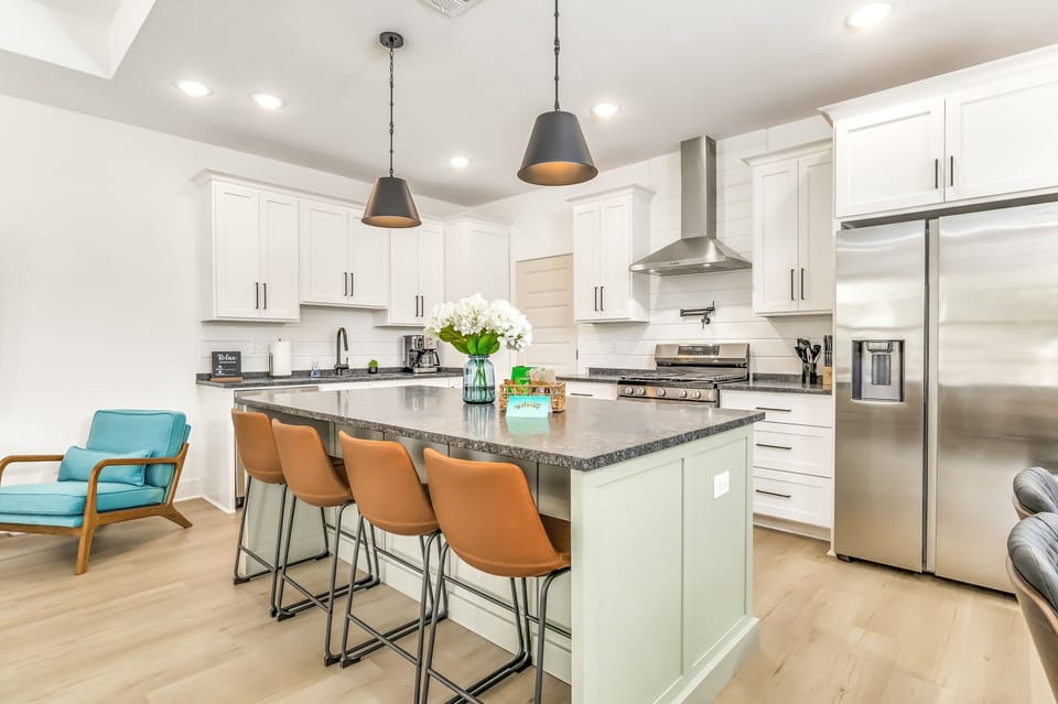 Counter seating with 4 stools, plus a dining table and 4 chairs.