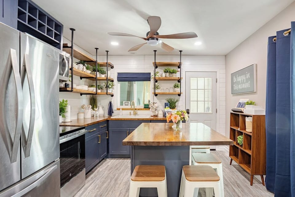 Fully equipped kitchen with stainless steel appliances, coffee station & more