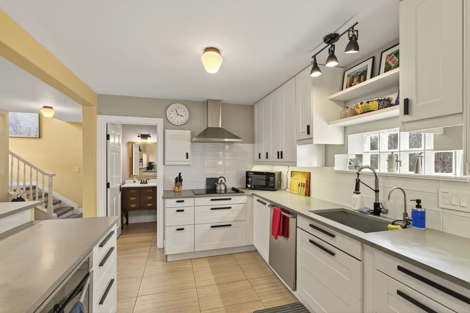 Modern kitchen with sleek counters and new stainless appliances