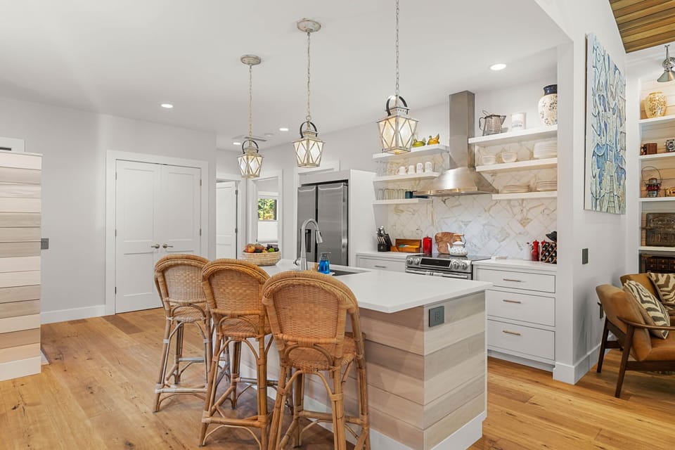 Kitchen with island and pendant lights.
