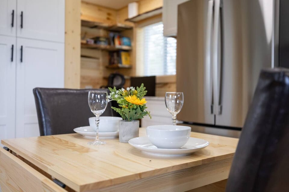 Set the scene for a cozy and romantic meal in our charming dining area, where soft lighting and elegant touches create the perfect ambiance.
