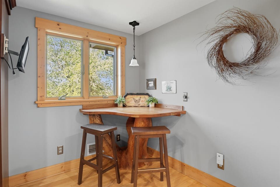 Quaint breakfast nook with window views of the outdoors.