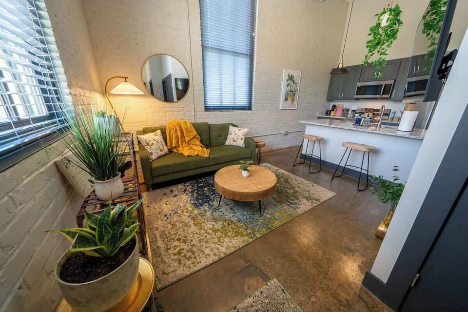 Relax in a modern space enhanced with refreshing green accents.