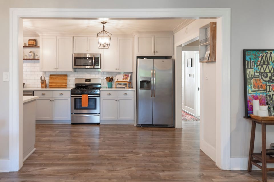 Open-concept kitchen with stainless steel appliances and modern design
