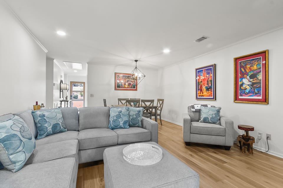 Spacious living room with comfy seating, fast WiFi, and a smart TV