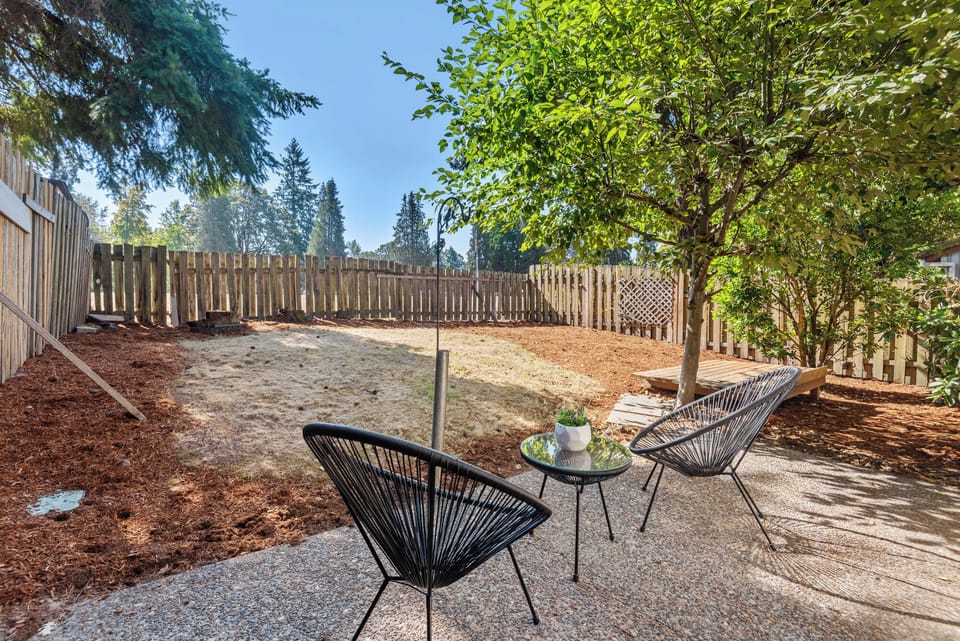 Step into your own private fenced backyard—perfect for pets, kids, or enjoying morning coffee under the tree.