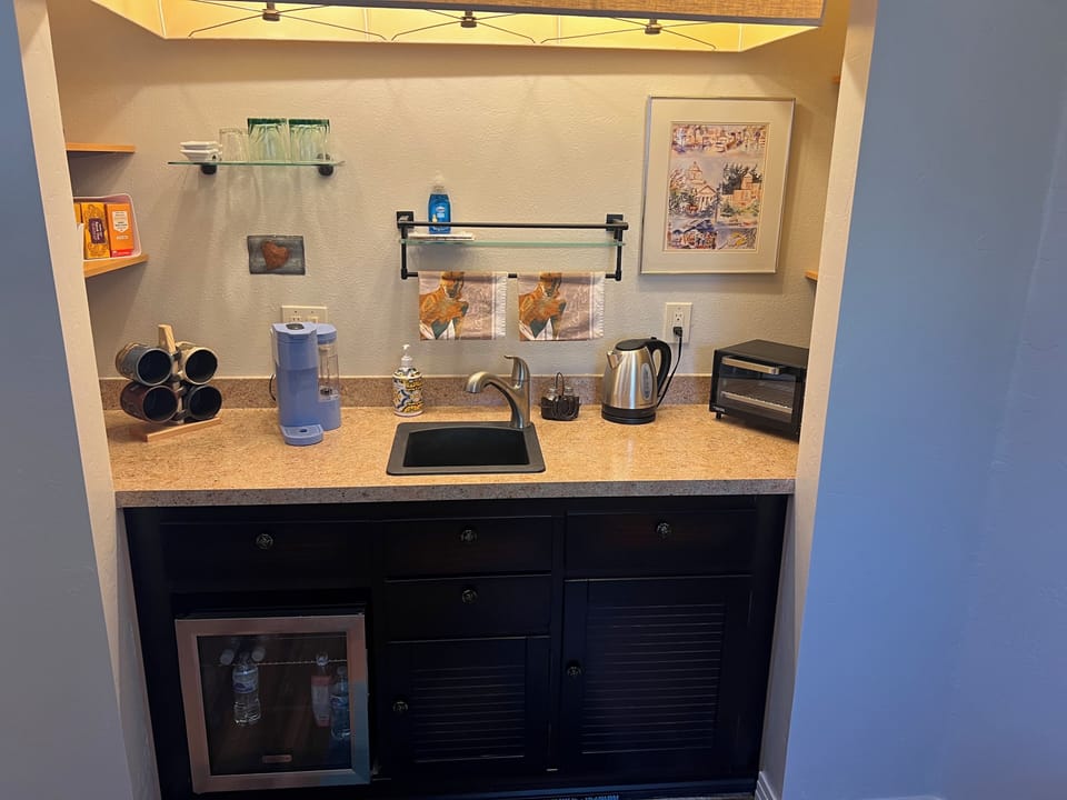 Kitchenette with coffee and toaster oven. Small fridge. Grill available on patio