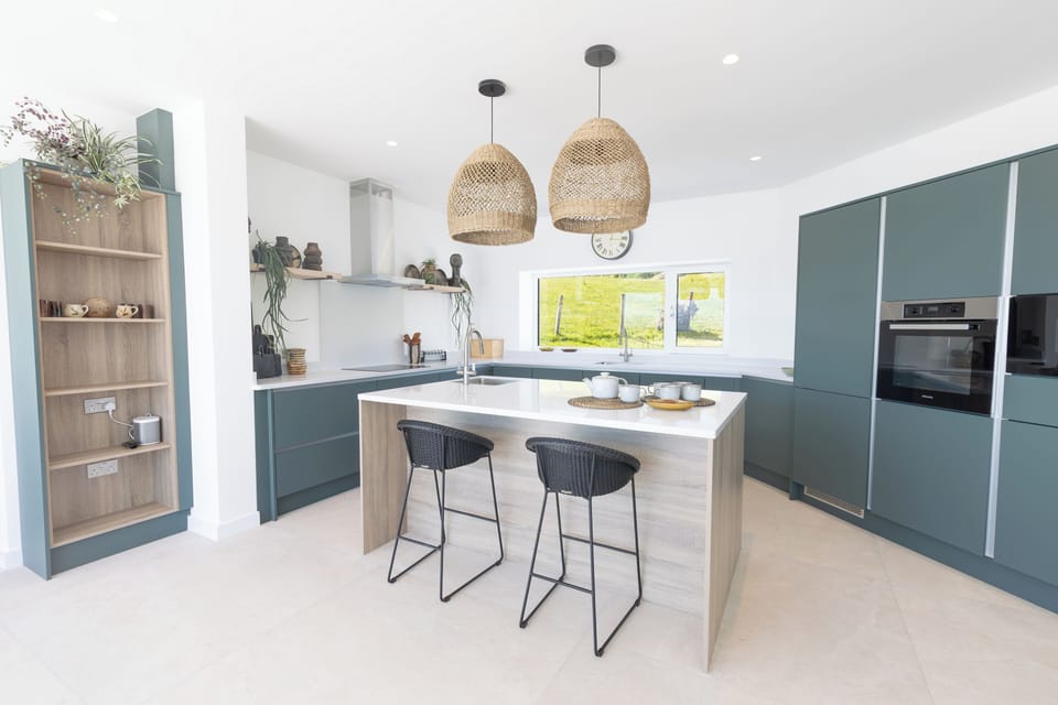 Kitchen with island, Corian work surfaces, and Miele appliances
