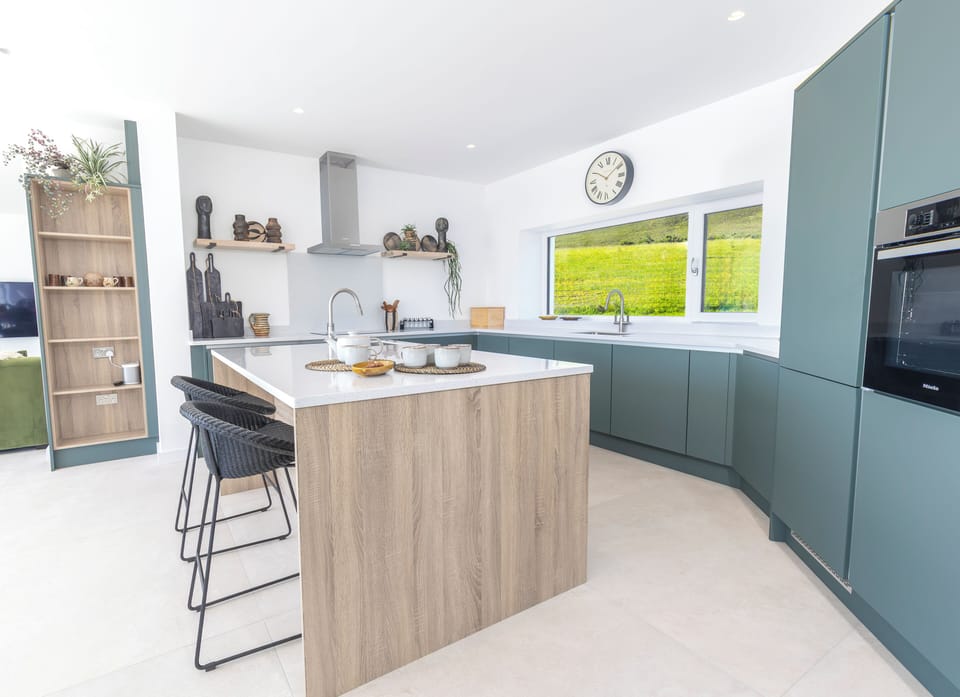 Kitchen with views over property's rear field to National Heritage Area