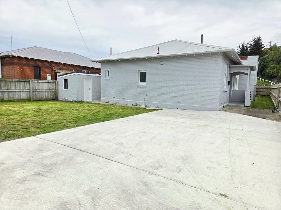 Large driveway and yard area