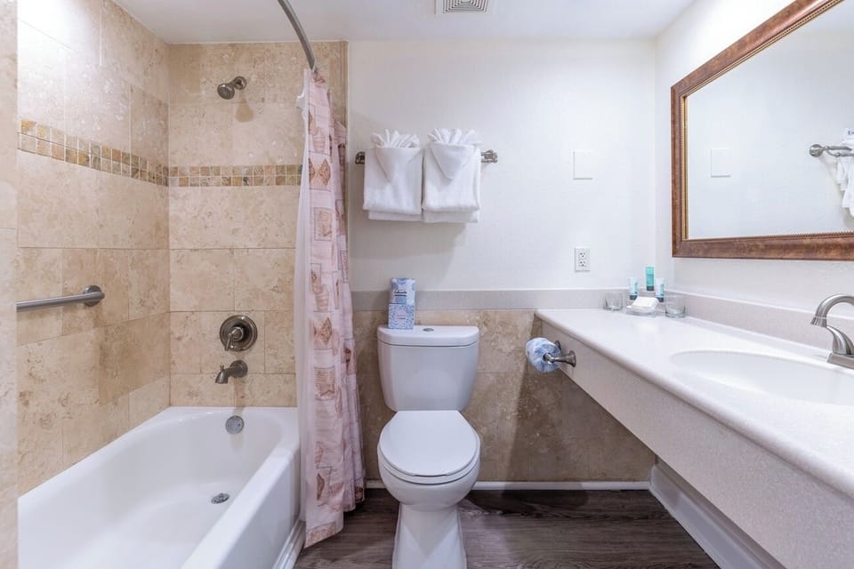 Soak and reset in a clean tub-and-shower combo.