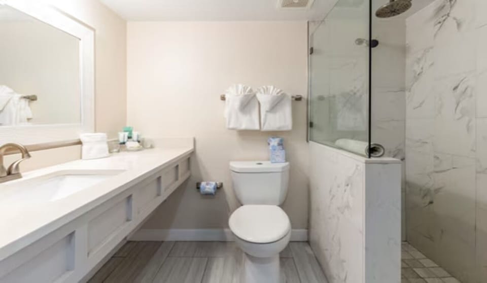 Rinse off in a bright, modern shower after swimming.