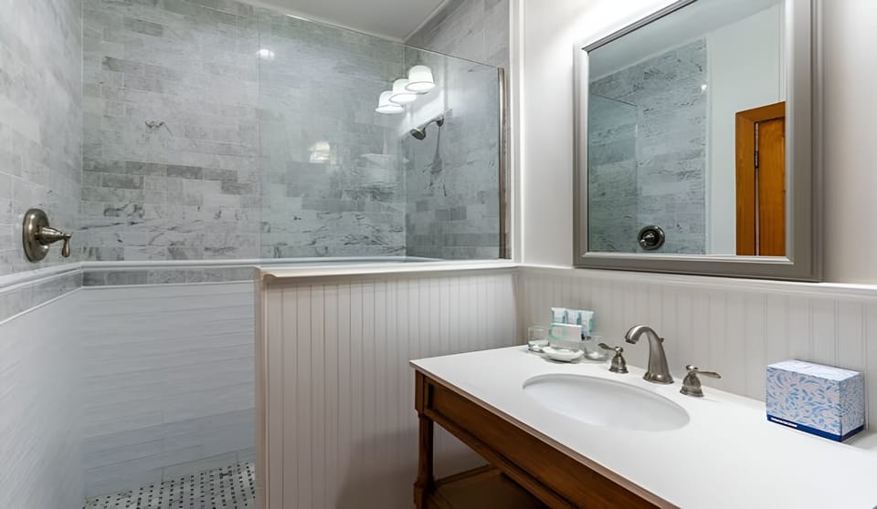Refresh under a bright vanity, steps from the shower.