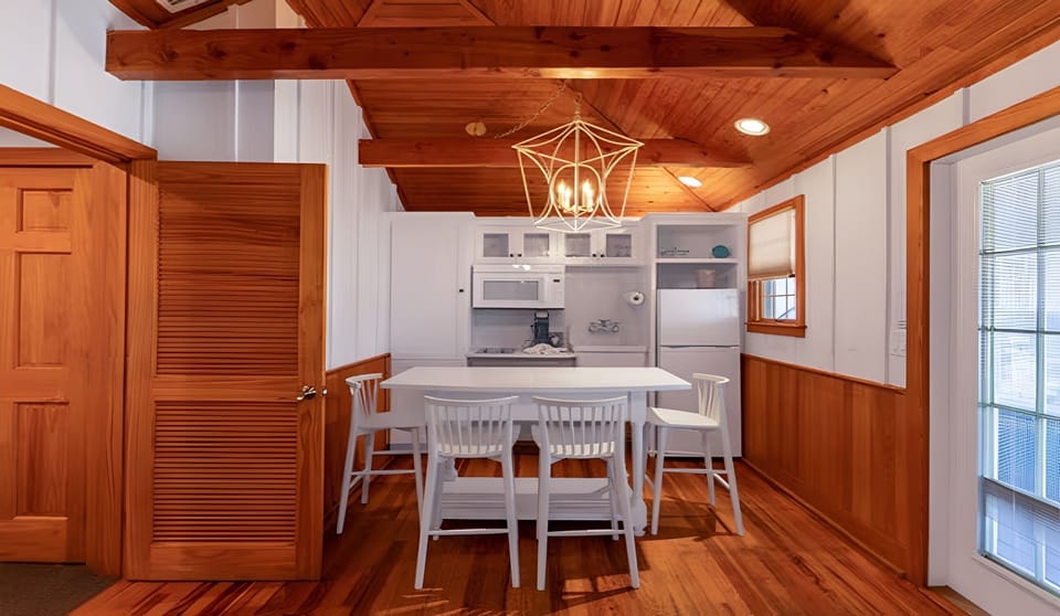 Enjoy easy meals at the bright dining table and kitchenette.