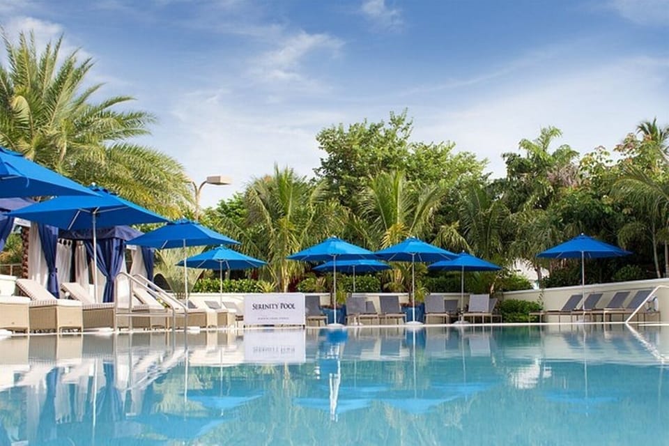 Settle into a shaded cabana for peaceful poolside relaxation.