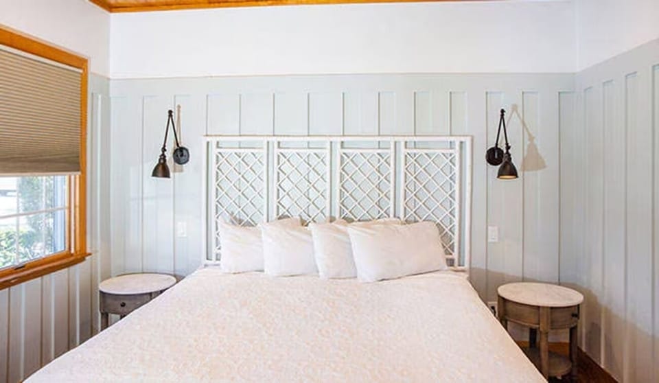 Drift off comfortably in a warm bedroom with coastal charm.