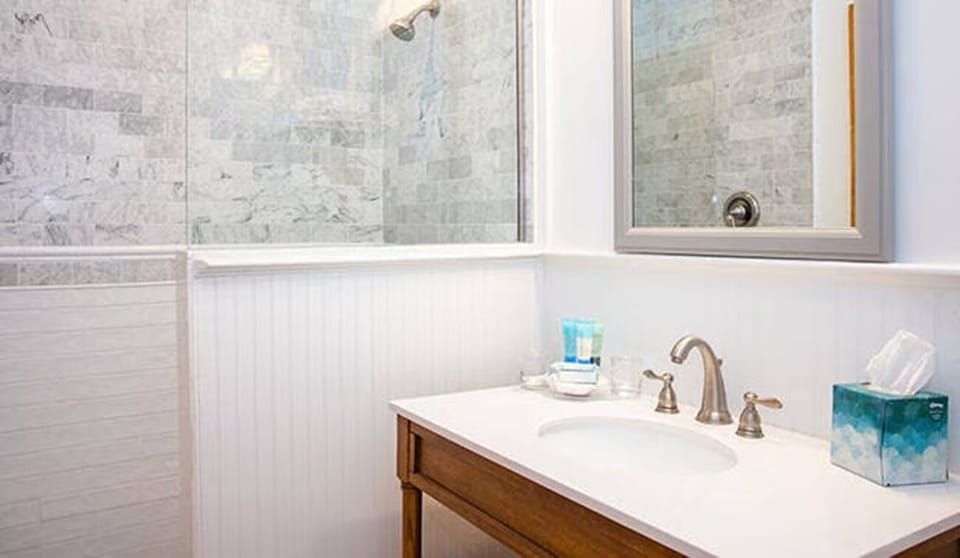 Enjoy a quick refresh with clean counters and a glass shower.