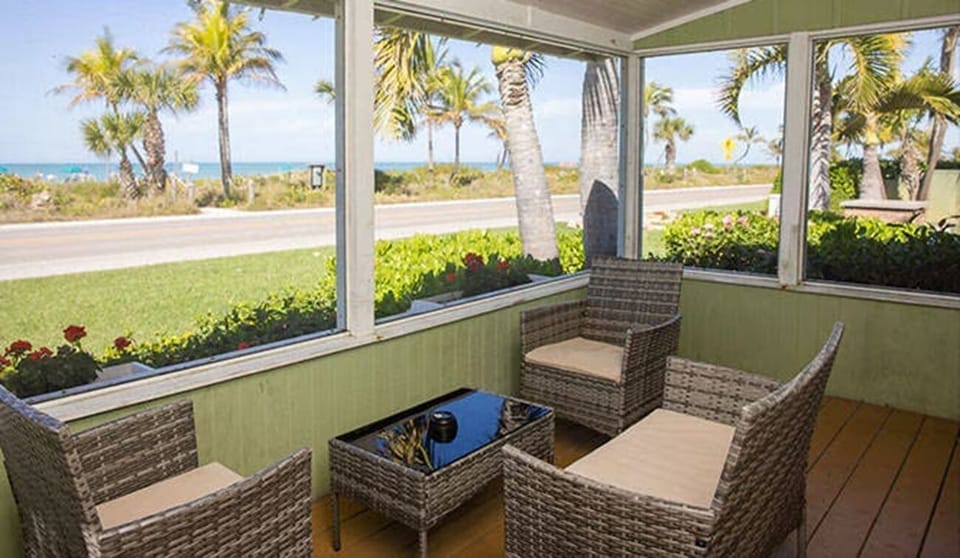 Unwind with ocean breezes on your private screened porch.