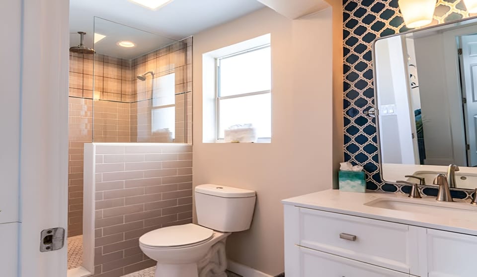 Refresh in a bright, modern bath with sleek tiled shower.