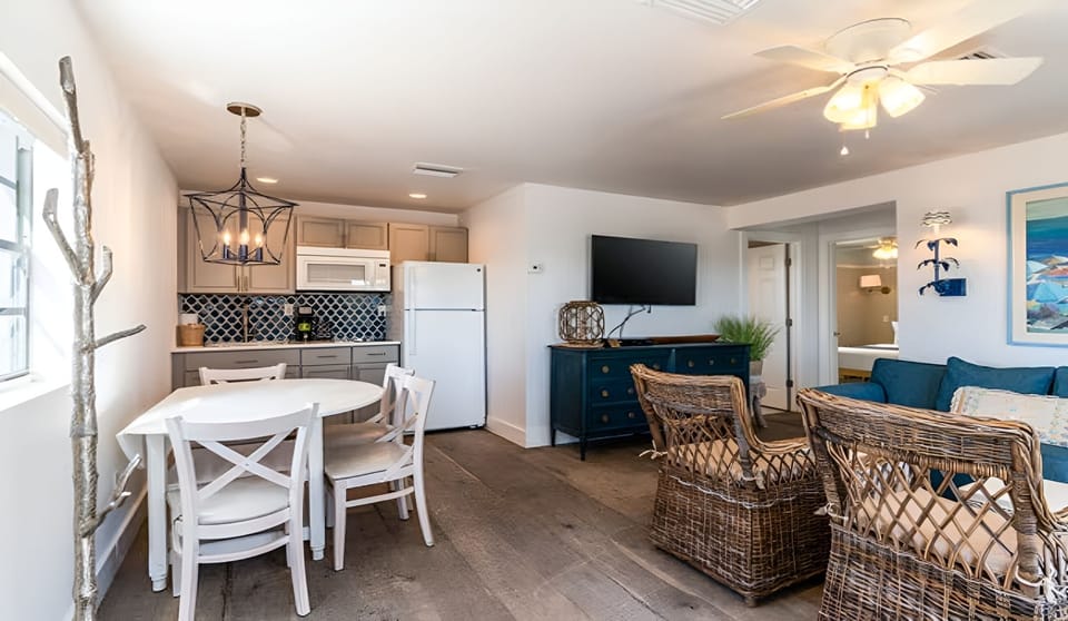 Gather for meals and movies in an airy, open-concept space.