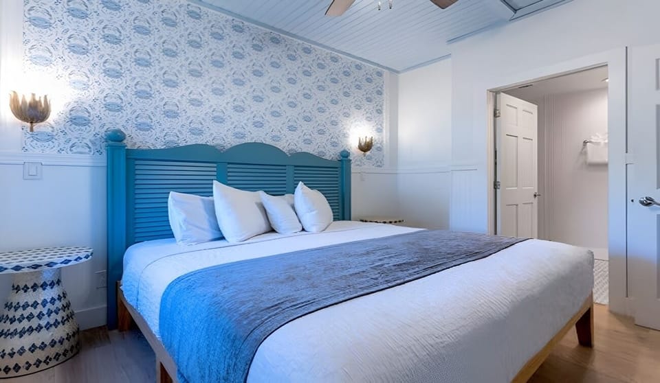 Sink into crisp linens in this serene coastal bedroom.