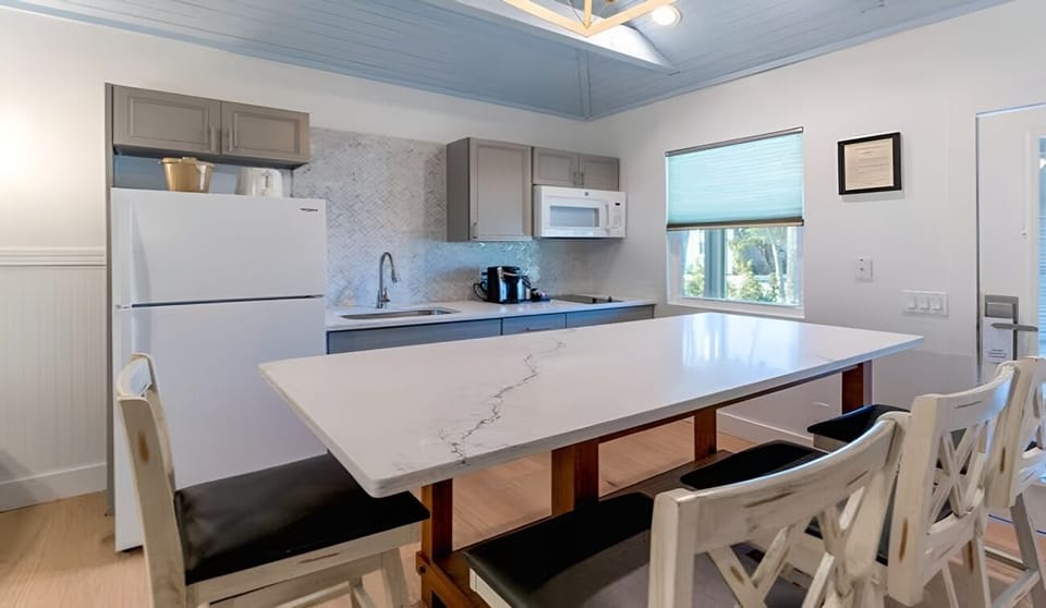 Serve easy breakfasts around the spacious table and modern kitchenette.