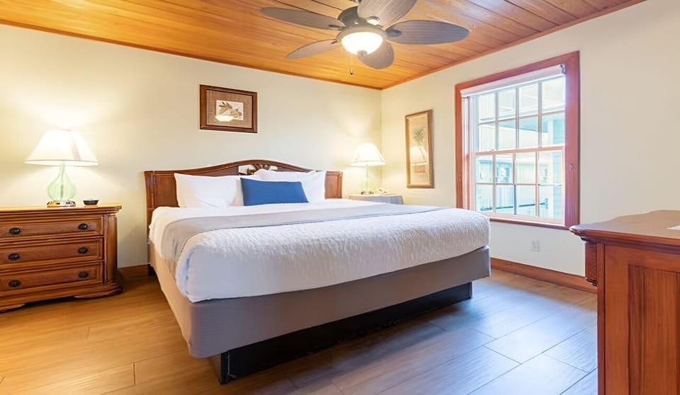 Drift off comfortably beneath the fan in this airy room.