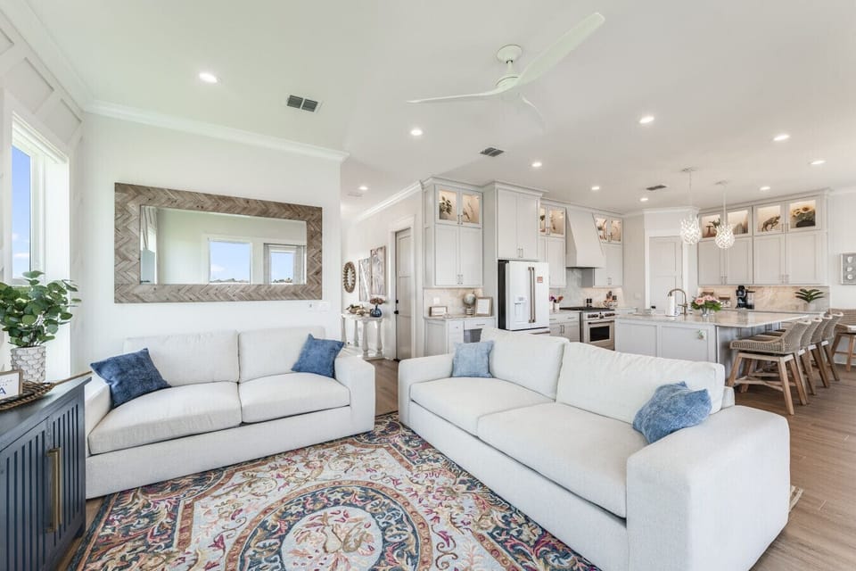 “Modern coastal comfort meets style in this breezy, open-concept space.”