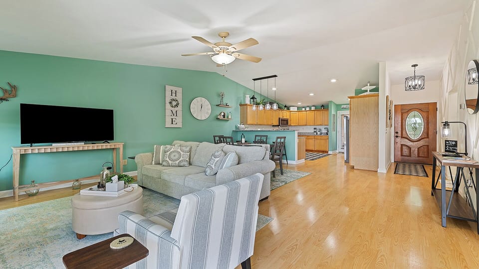 Spacious open floor plan with cozy seating & large TV for family nights