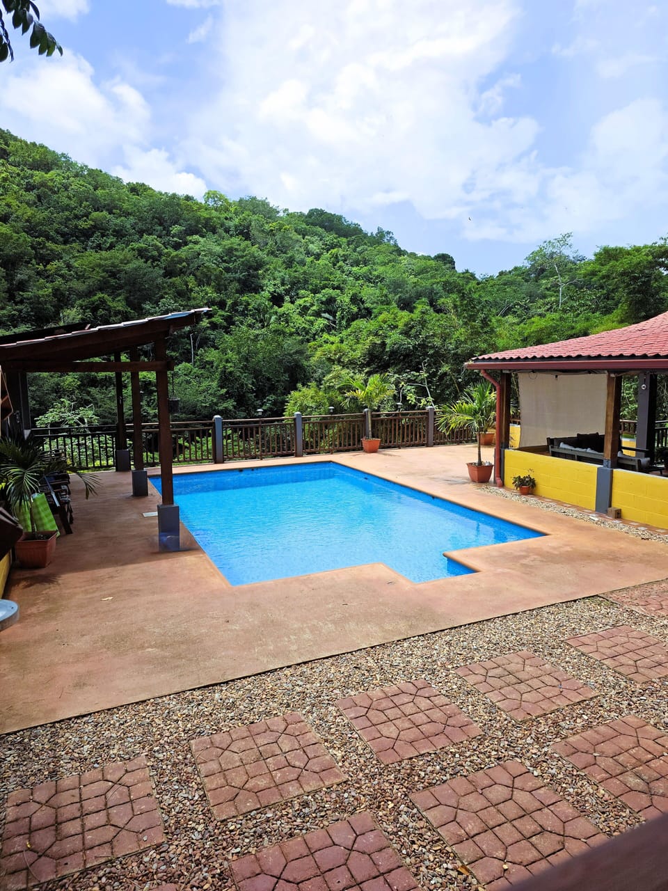 Your refreshing escape awaits! Dive into the shared pool with stunning views.