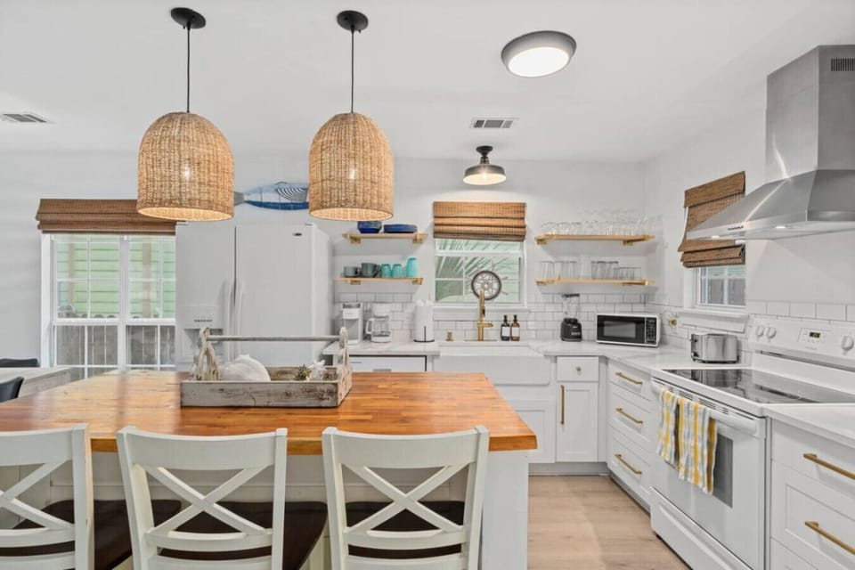 Fully equipped Kingfish kitchen with large island, modern appliances & plenty of space to cook together.