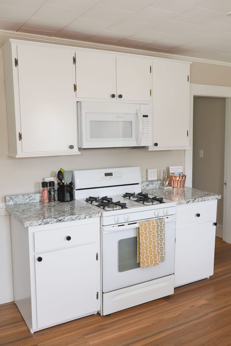 Cooktop, microwave, and kitchen basics are available to cook and eat in. 