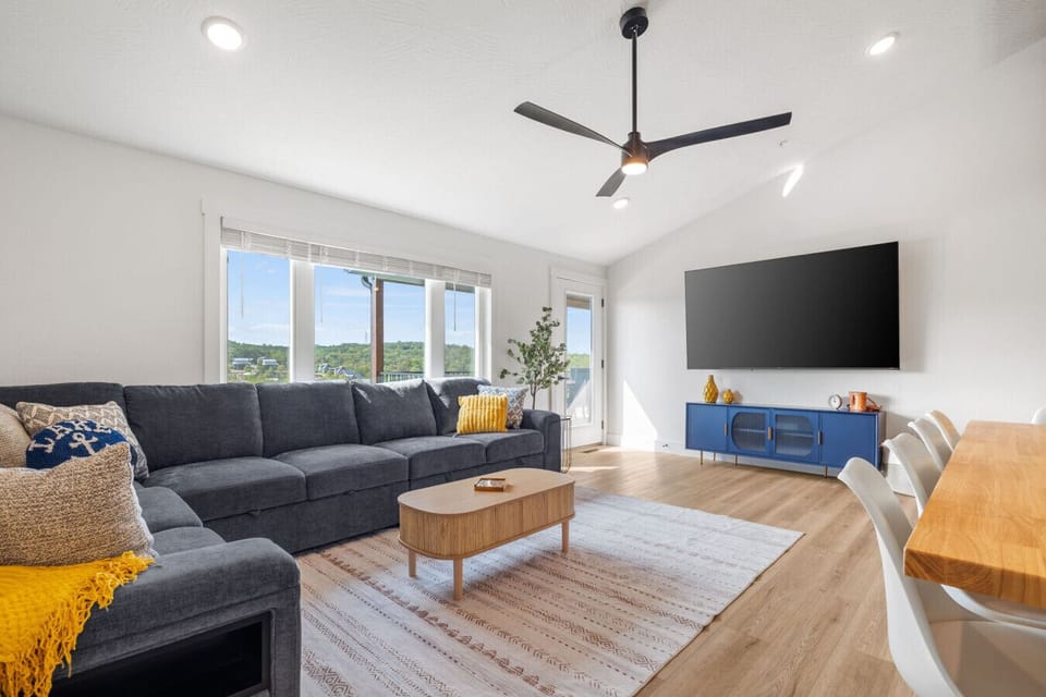 Spacious open upstairs living and dining area designed for gathering.