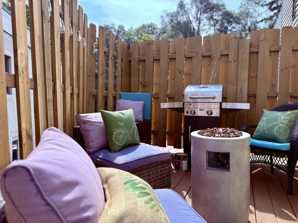 Private deck complete with grill, seating, and propane fire table.