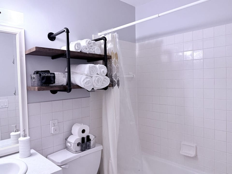 Bathroom with shower and bathtub.