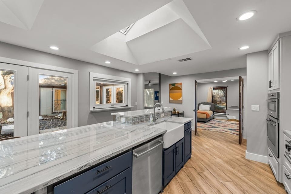 Kitchen of dreams! This large island is perfect to gather for coffee in the mornings, cook together throughout the day and keep an eye on any kids or beloved pets as they play outside.