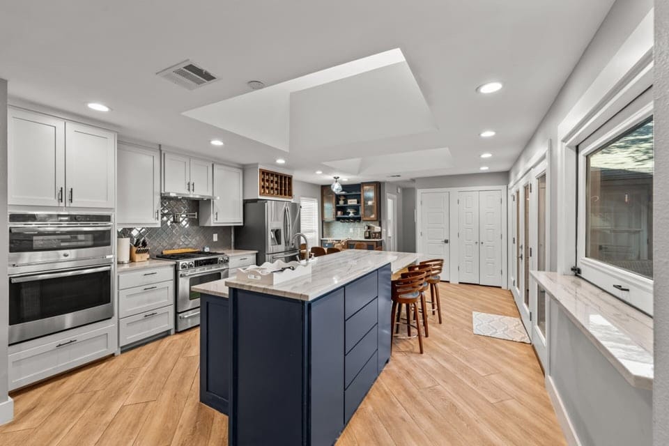 Gorgeous kitchen island where you can gather to enjoy coffee, wine or your meals.