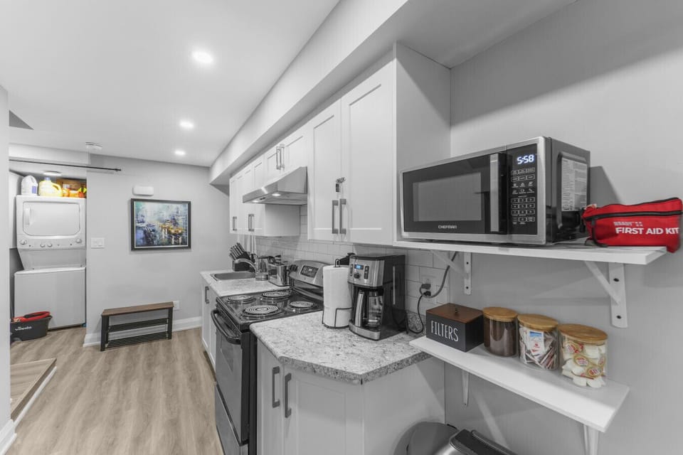 Cook, clean, and relax! This bright kitchen is equipped for any meal, and the in-unit washer and dryer make longer stays simple and comfortable. All the conveniences of home are here.