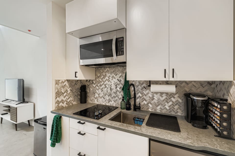 A Keurig coffee machine awaits with an assortment of coffees.