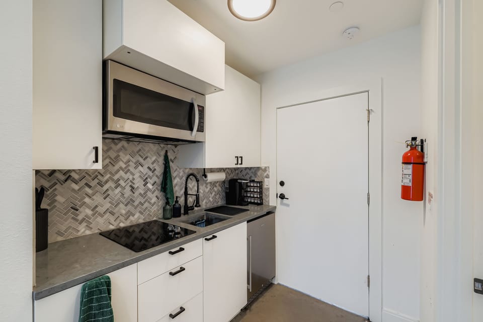 The kitchen is complete with a two-top burner and all the amenities you'll need.