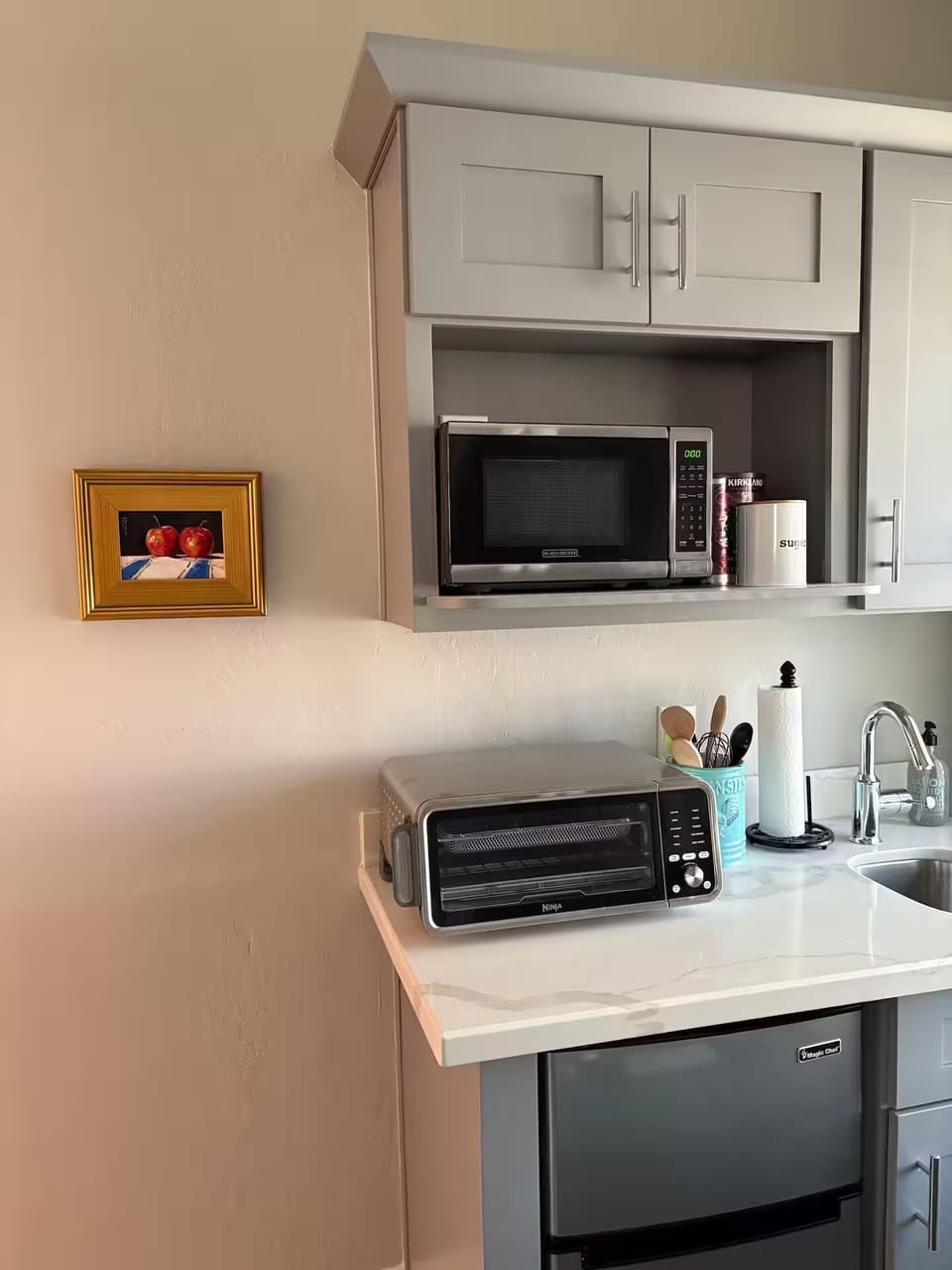 Mini kitchen with convection toaster oven.