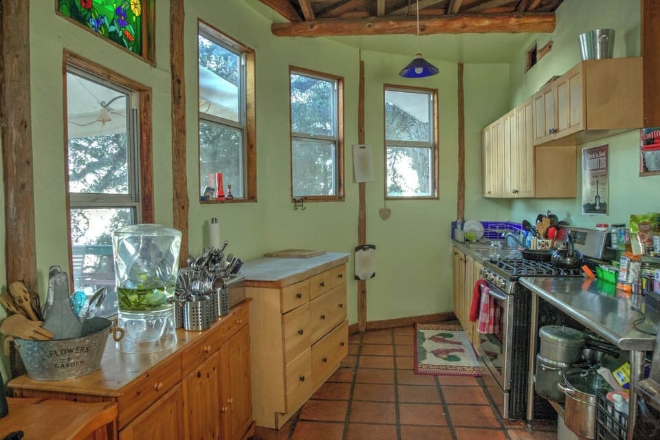 Main house kitchen fully supplied with 2 refrigerators, stove, oven, fully stocked kitchen for cooking