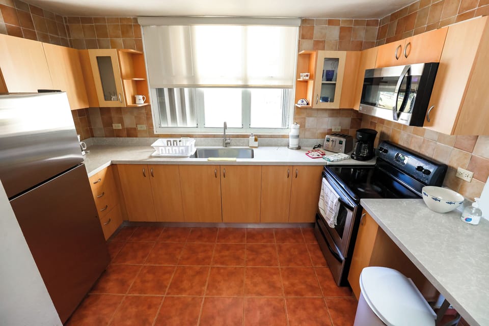 The kitchen is the home's heart, where flavors come alive.