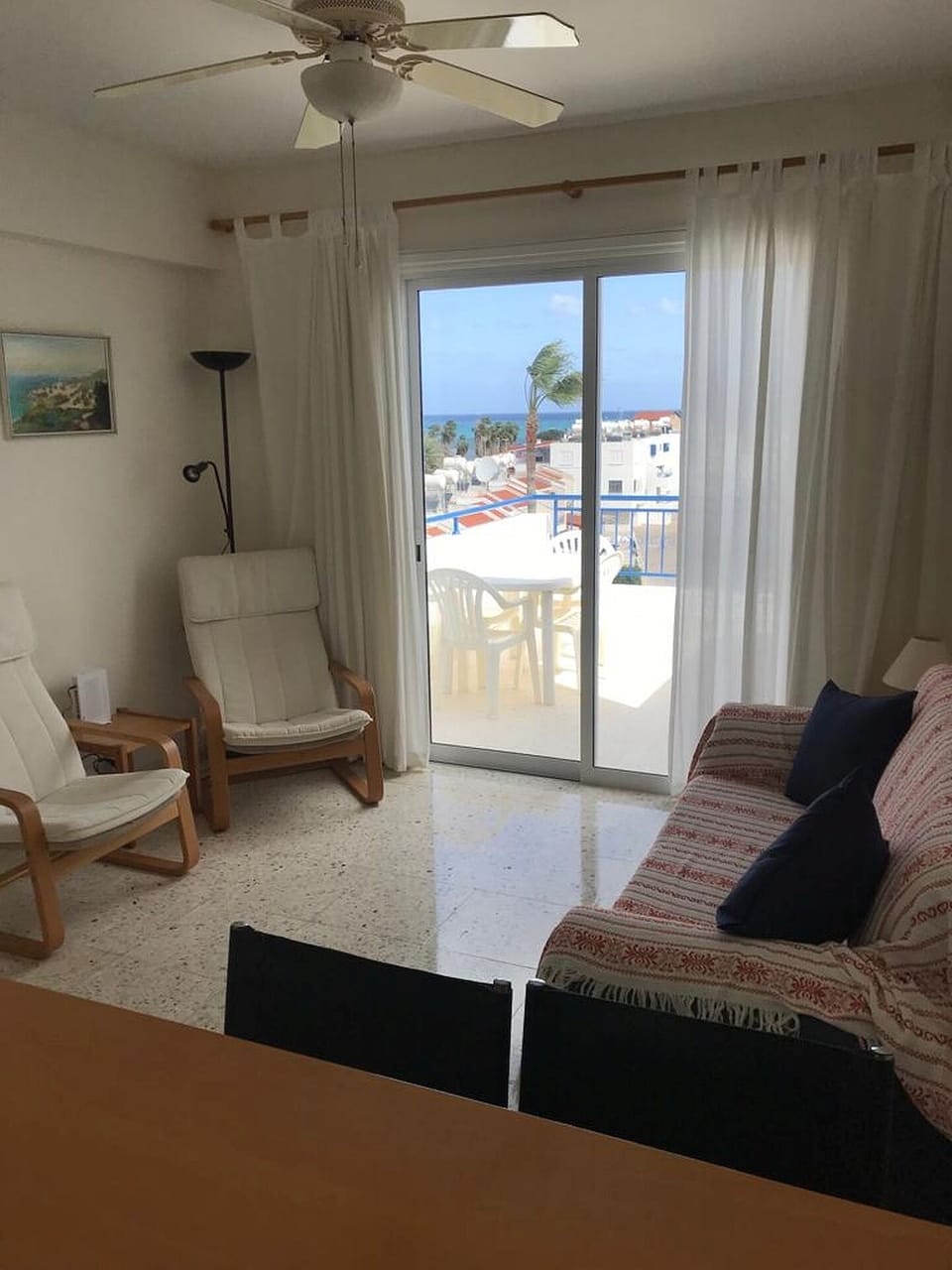 Living area with sofa and two armchairs