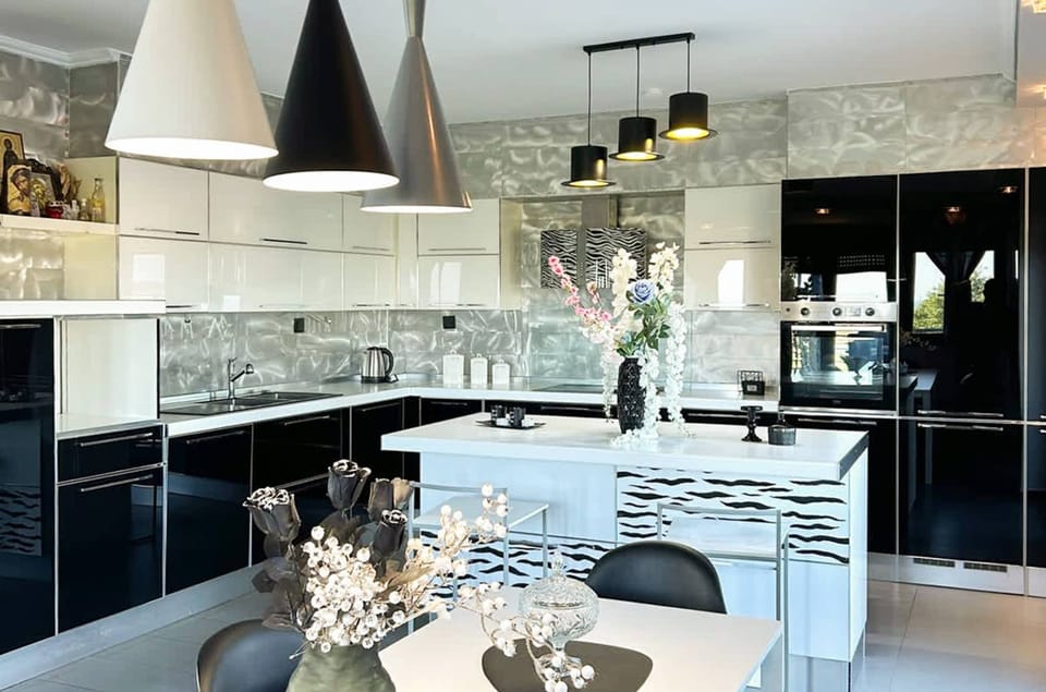 Fully-Equipped Kitchen with Breakfast Bar, Cooking Essentials, and Ample Storage