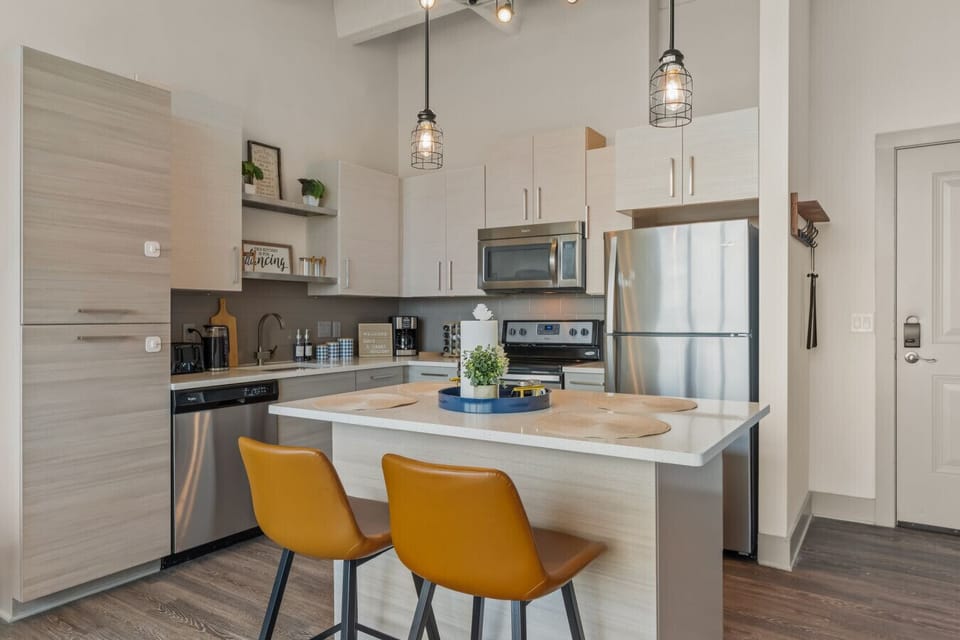 Modern Kitchen: Sleek design with chic seating, perfect for culinary adventures and casual gatherings!